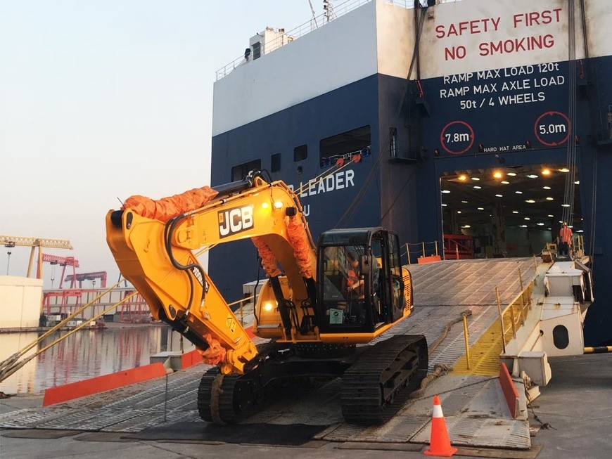 overseas excavator hauling