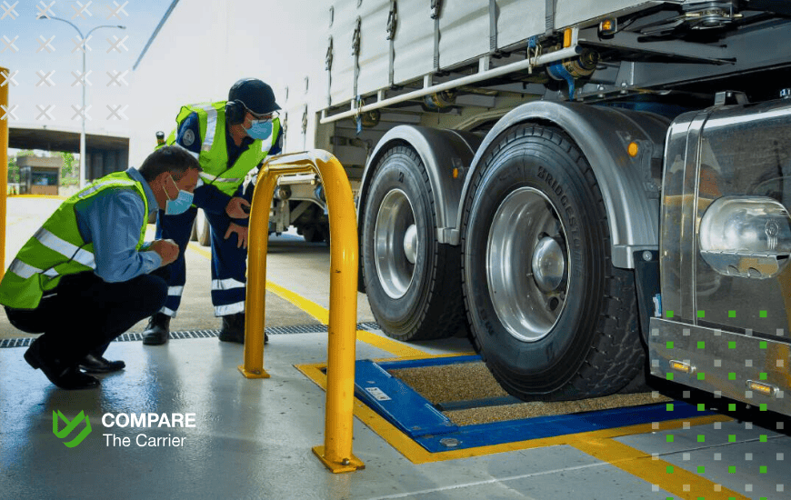 auto transport personal belongings Two transportation inspectors in safety vests and masks checking truck weight on a scale at a DOT weigh station during an auto transport inspection.
